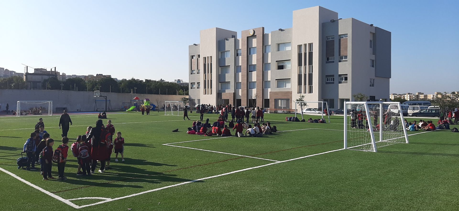 Stars College Abbasieh Building with students in playground