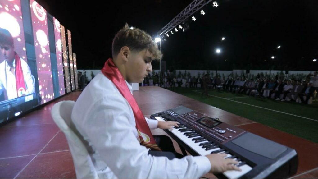 Students performing music at Stars College Ghaziyeh grand opening